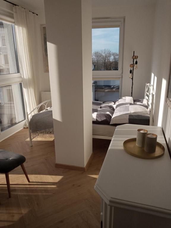 a living room with a couch and a bed at Apartament w centrum z panoramą miasta in Bielsko-Biała