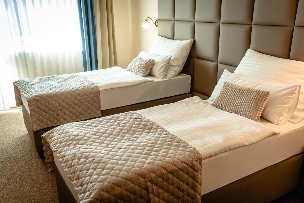 Postel nebo postele na pokoji v ubytování Dixon Resort