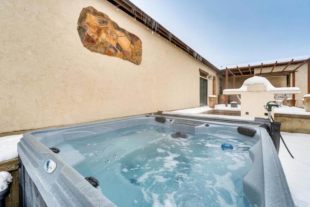 a hot tub on the side of a building at Epic East Wenatchee Home with Hot Tub and Game Room! in East Wenatchee