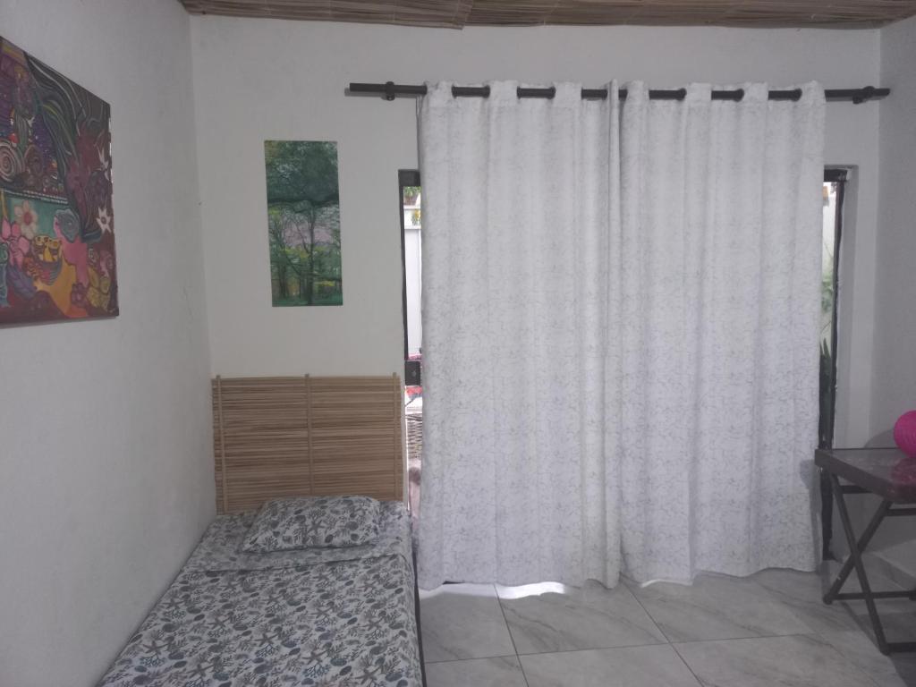 Postel nebo postele na pokoji v ubytování La Petite Maison de Diana