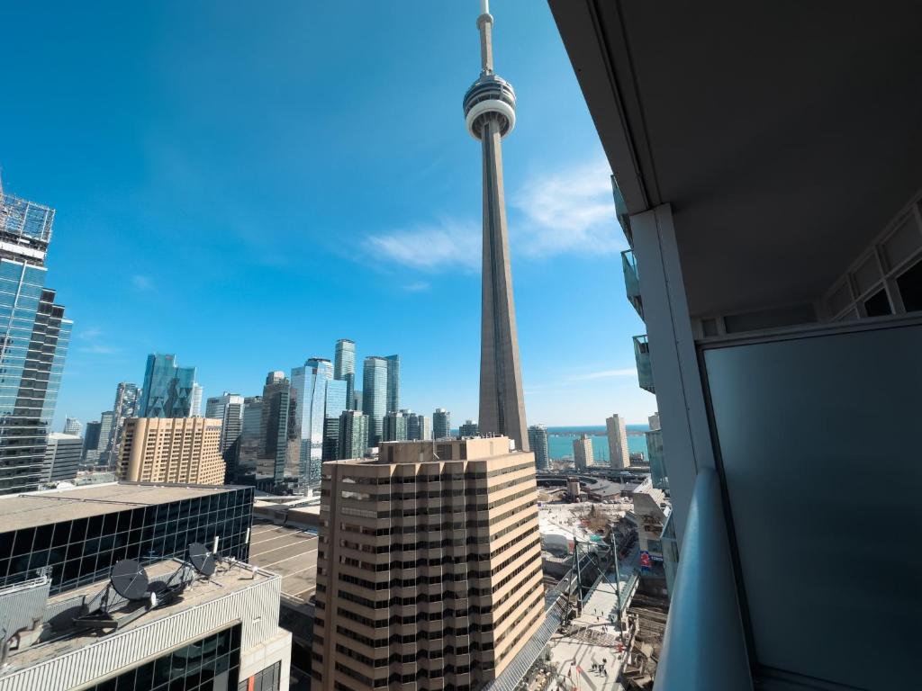 a view of the cn tower from a building at 300 Front Suites - Two Beds with Free Parking in Toronto