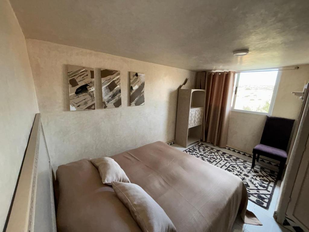 Postel nebo postele na pokoji v ubytování Riad Dar Naima Imsouane
