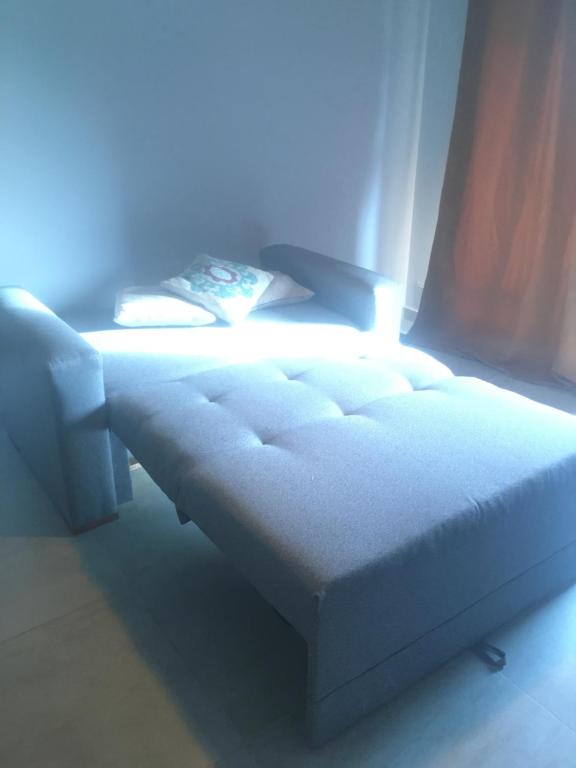 a bed in a room with a light on it at Villa María in Villa María