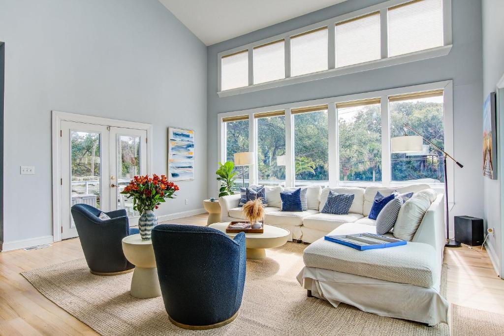 a living room with a white couch and chairs at Edgewater 5 in Isle of Palms