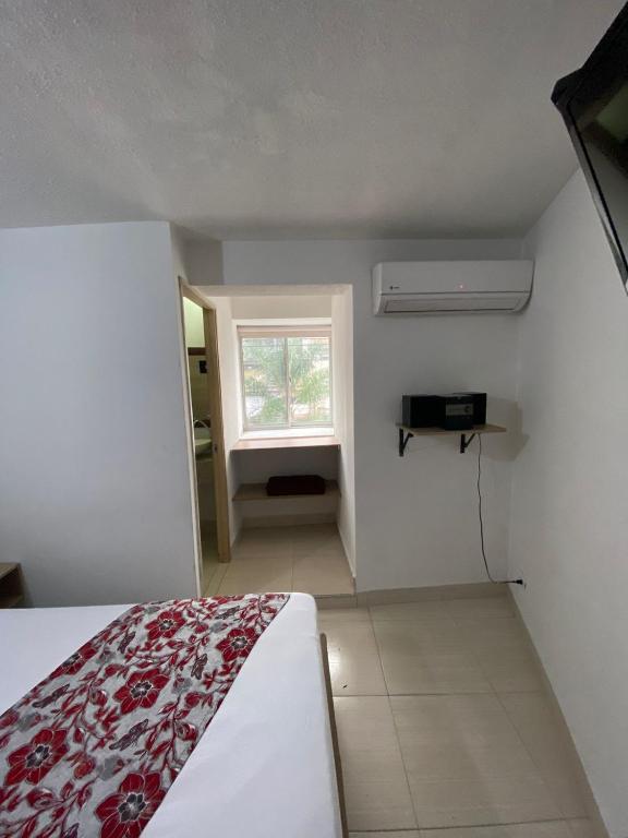 Postel nebo postele na pokoji v ubytování Suites Laureles