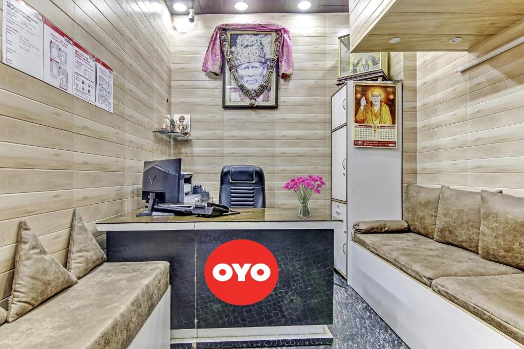 a small office with a desk and a computer at OYO Sun Shine Hotel Laxmi Nagar in New Delhi