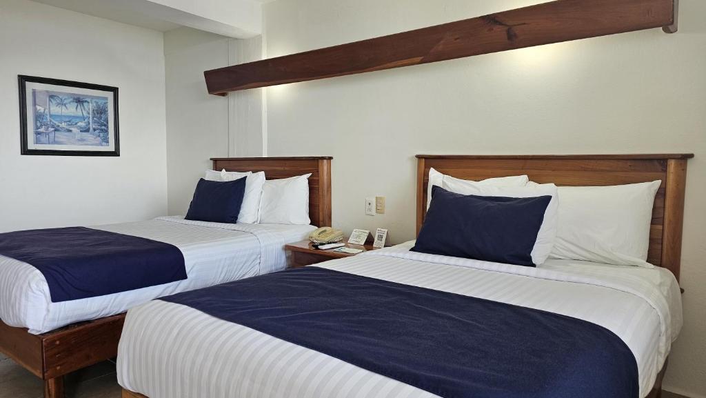 Postel nebo postele na pokoji v ubytování Best Western Riviera Tuxpan