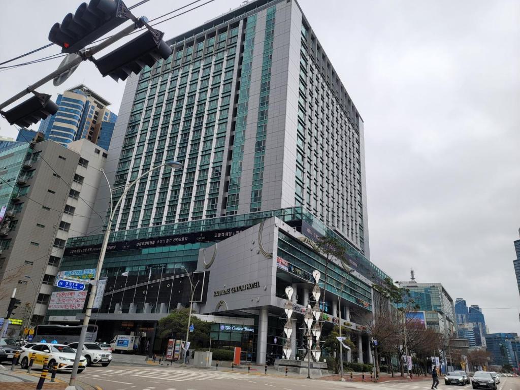 a tall building with a lot of windows in a city at W Residence Hotel Centum City in Busan