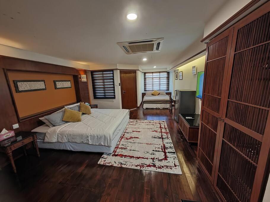 a bedroom with a bed and a living room at Port Dickson Teluk Kemang Pantai Tanjung Gemok by 3SIBS in Port Dickson
