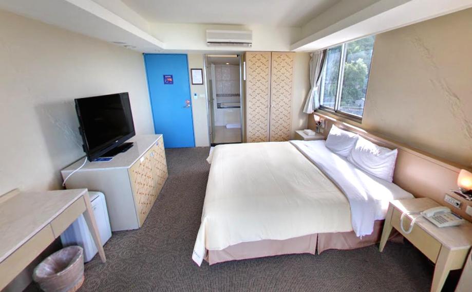 Postel nebo postele na pokoji v ubytování Blue Ocean Hotel