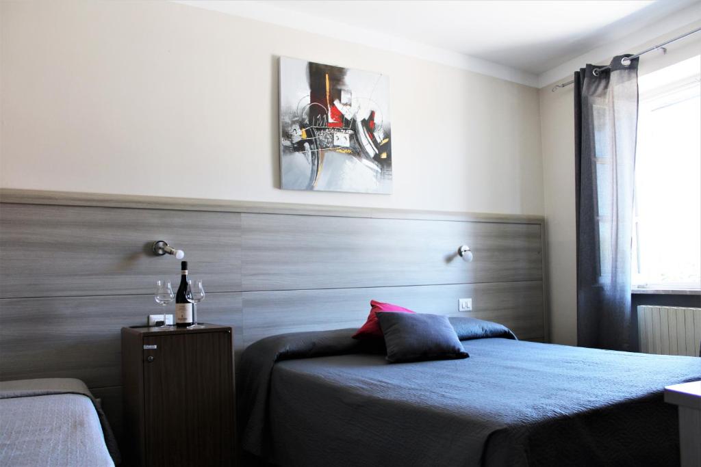Postel nebo postele na pokoji v ubytování Nuovo Hotel Giardini