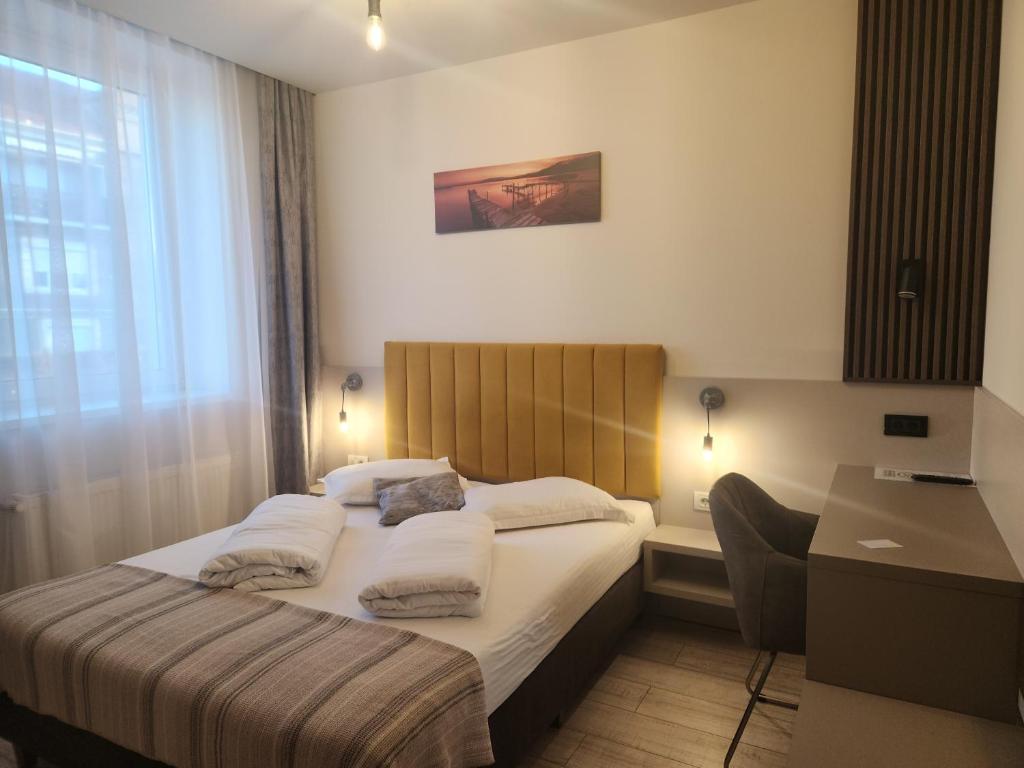 Postel nebo postele na pokoji v ubytování XO Residence