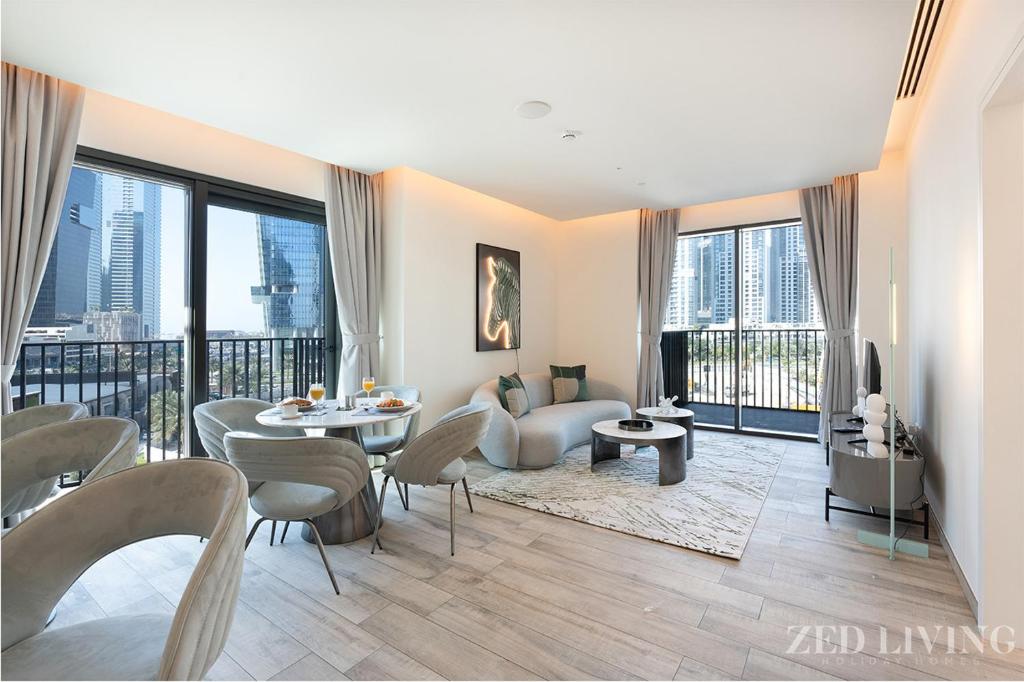 a living room with a view of a building at Zed Living - Ahad Residences - Tranquil 1 BR in Business Bay in Dubai