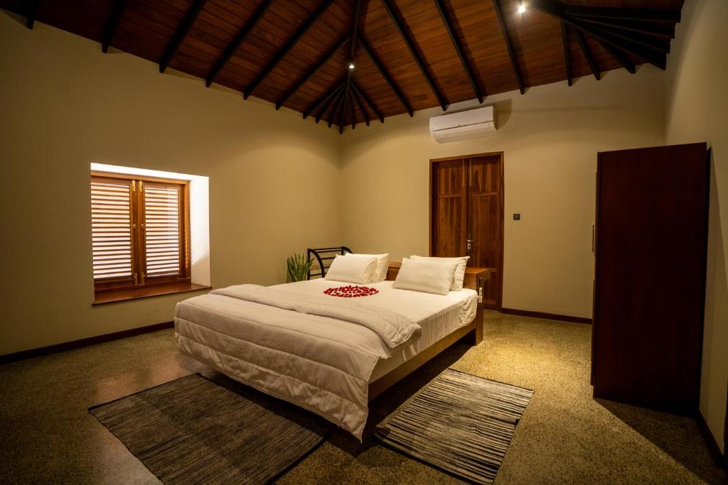 Letto o letti in una camera di Omkara Rekawa