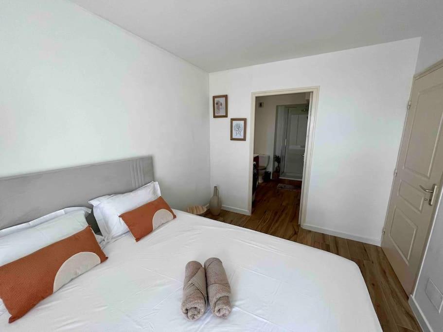 Postel nebo postele na pokoji v ubytování Bel appartement vue mer - Mafat'appart