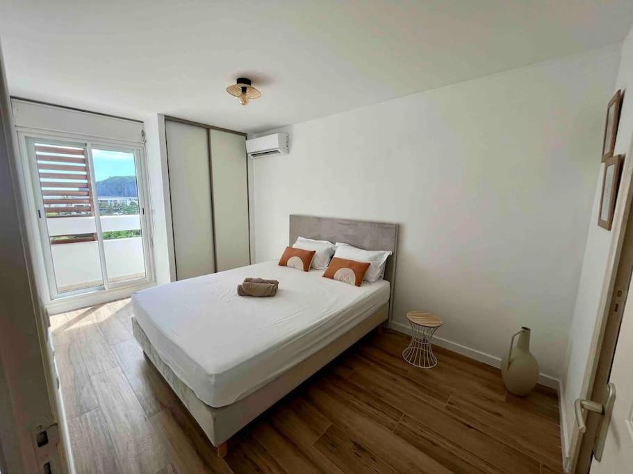 Postel nebo postele na pokoji v ubytování Bel appartement vue mer - Mafat'appart