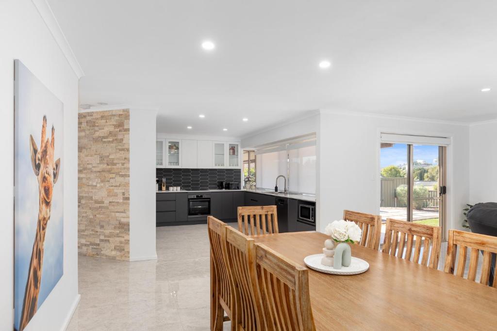 a kitchen and dining room with a table and chairs at Heinlen on North Terrace in Mount Gambier
