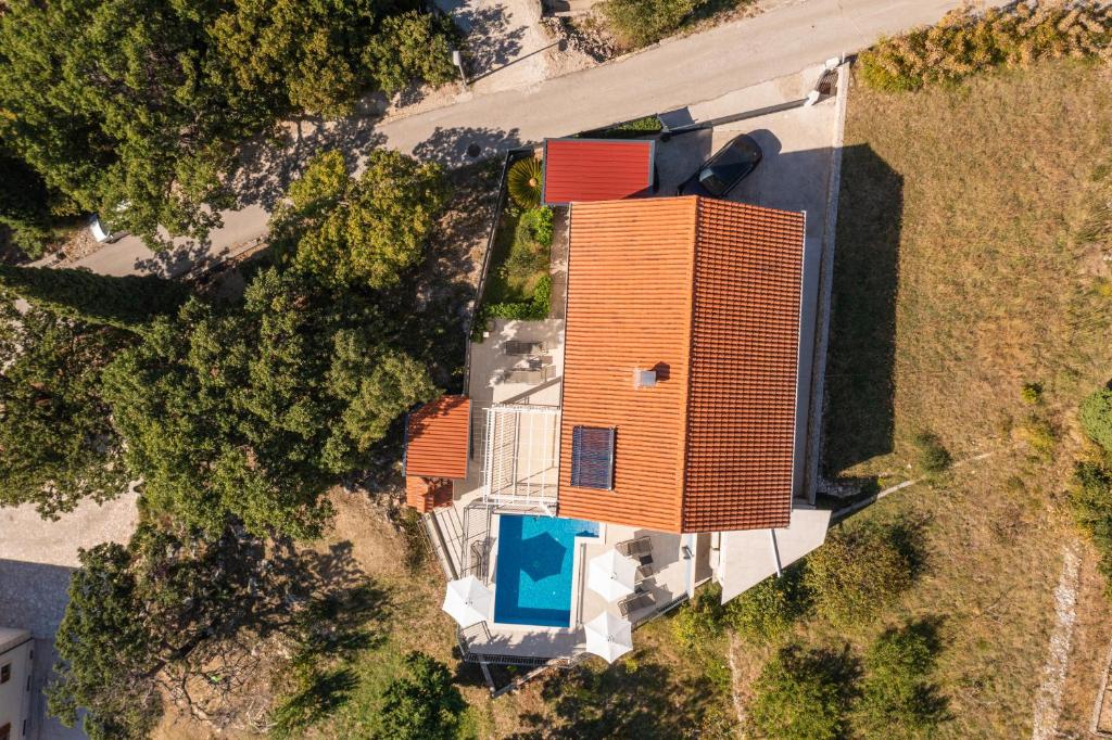 an overhead view of an orange building with a pool at Villa Mambo in Mlini