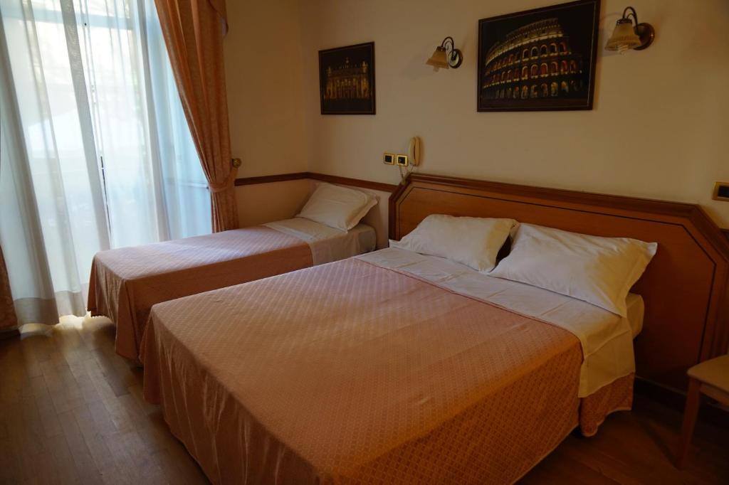 Postel nebo postele na pokoji v ubytování Green Hotel