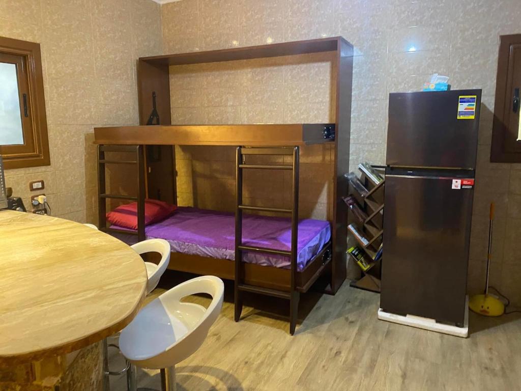 Postel nebo postele na pokoji v ubytování Family House بيت العيلة