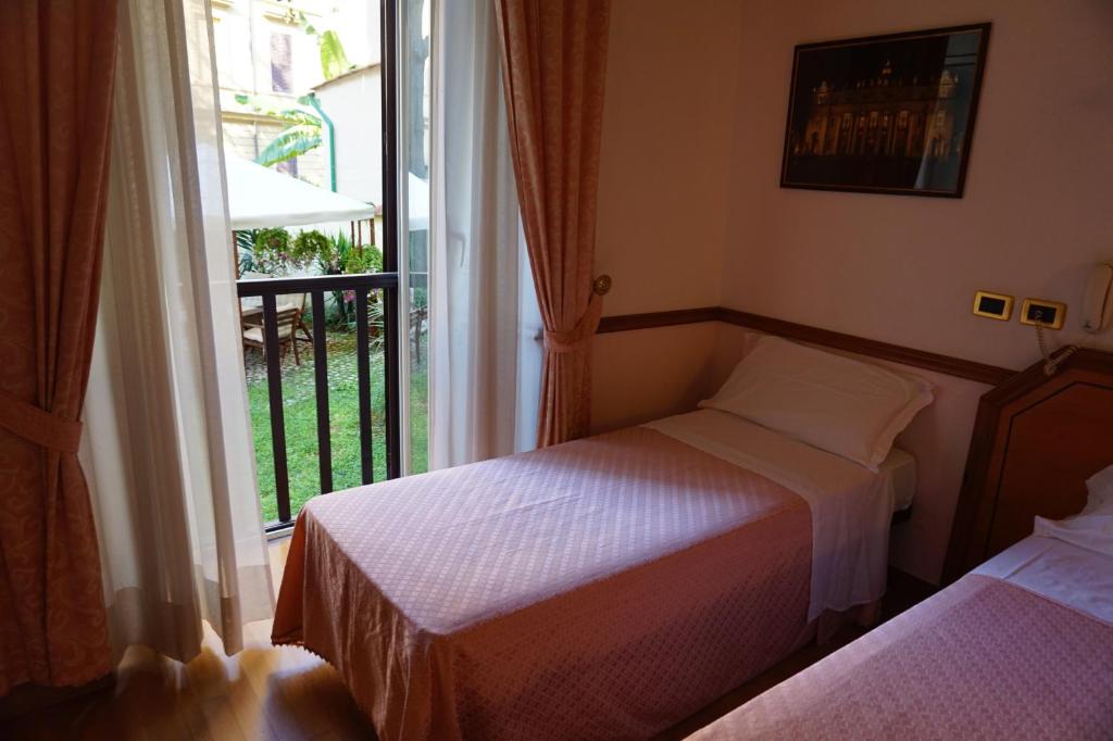 Postel nebo postele na pokoji v ubytování Green Hotel