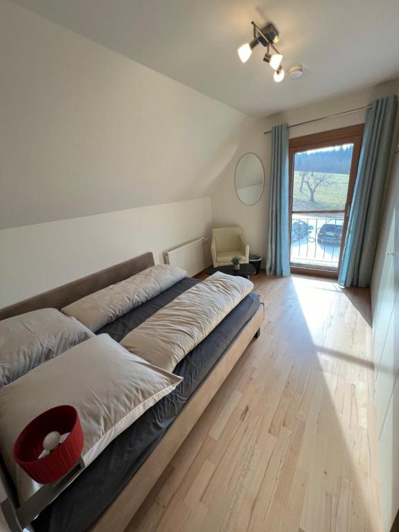 Postel nebo postele na pokoji v ubytování Sonnenschein Appartement- und Ferienhaus mit Terrasse und Garten
