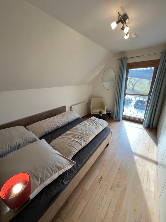 Postel nebo postele na pokoji v ubytování Sonnenschein Appartement- und Ferienhaus mit Terrasse und Garten