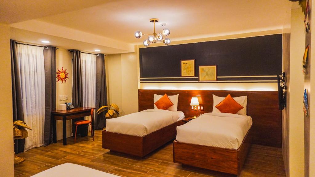 Postel nebo postele na pokoji v ubytování UNWND Boutique Hotel Camiguin