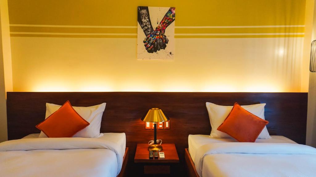 Postel nebo postele na pokoji v ubytování UNWND Boutique Hotel Camiguin