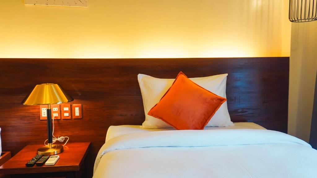 Postel nebo postele na pokoji v ubytování UNWND Boutique Hotel Camiguin