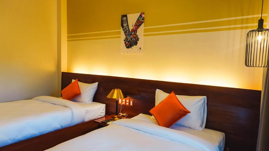 Postel nebo postele na pokoji v ubytování UNWND Boutique Hotel Camiguin