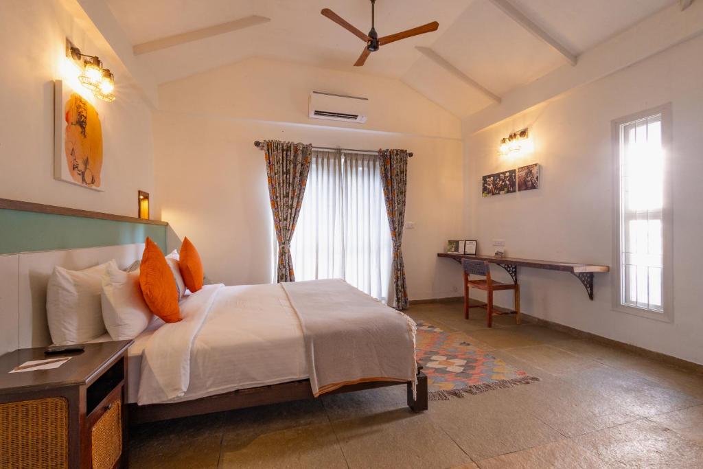 Ένα ή περισσότερα κρεβάτια σε δωμάτιο στο Machaan Wilderness Lodge Nagarahole
