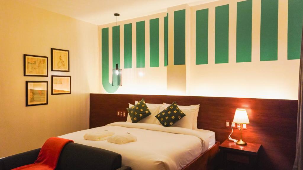 Postel nebo postele na pokoji v ubytování UNWND Boutique Hotel Camiguin