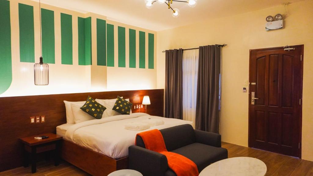 Postel nebo postele na pokoji v ubytování UNWND Boutique Hotel Camiguin