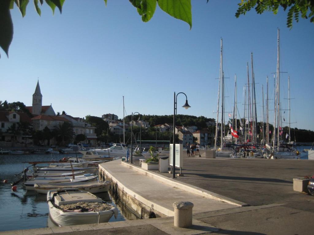 a marina with boats docked in the water at Apartment Tara in Sumartin
