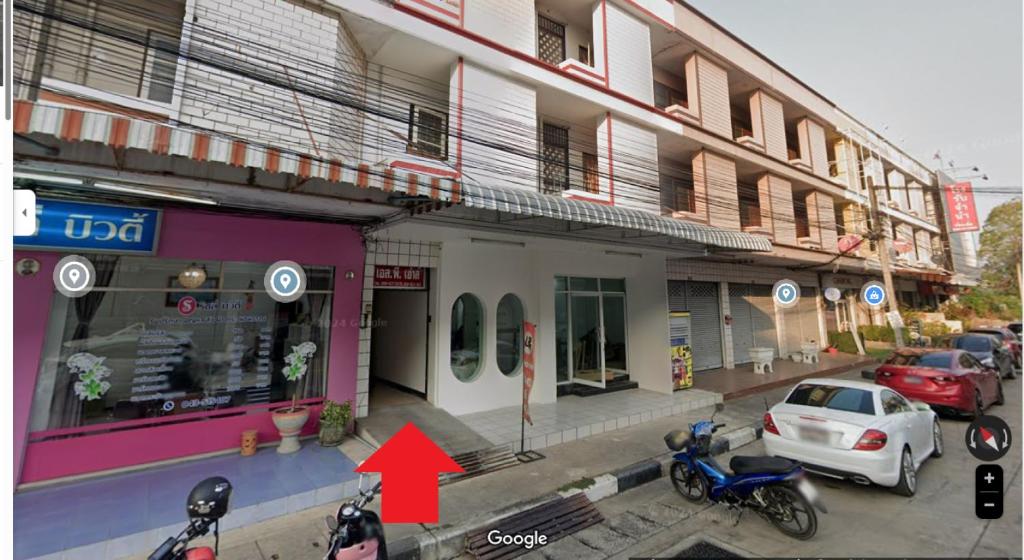 a building with motorcycles parked in front of it at SP House RoiEd in Roi Et
