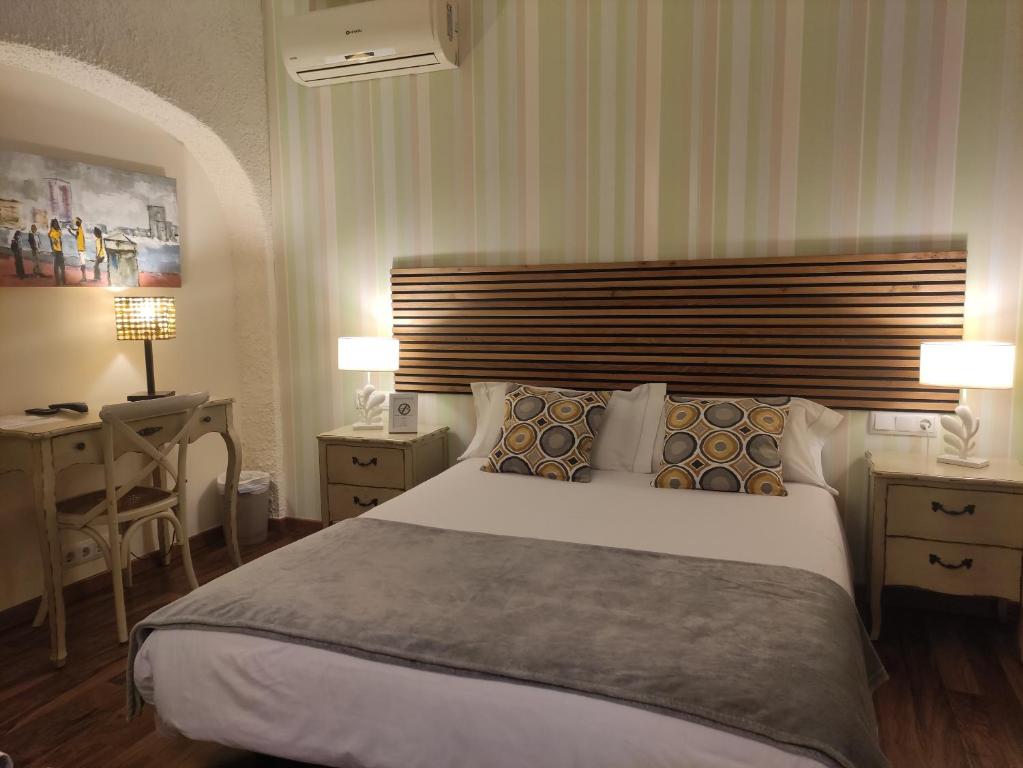 Postel nebo postele na pokoji v ubytování Cal Music B&B