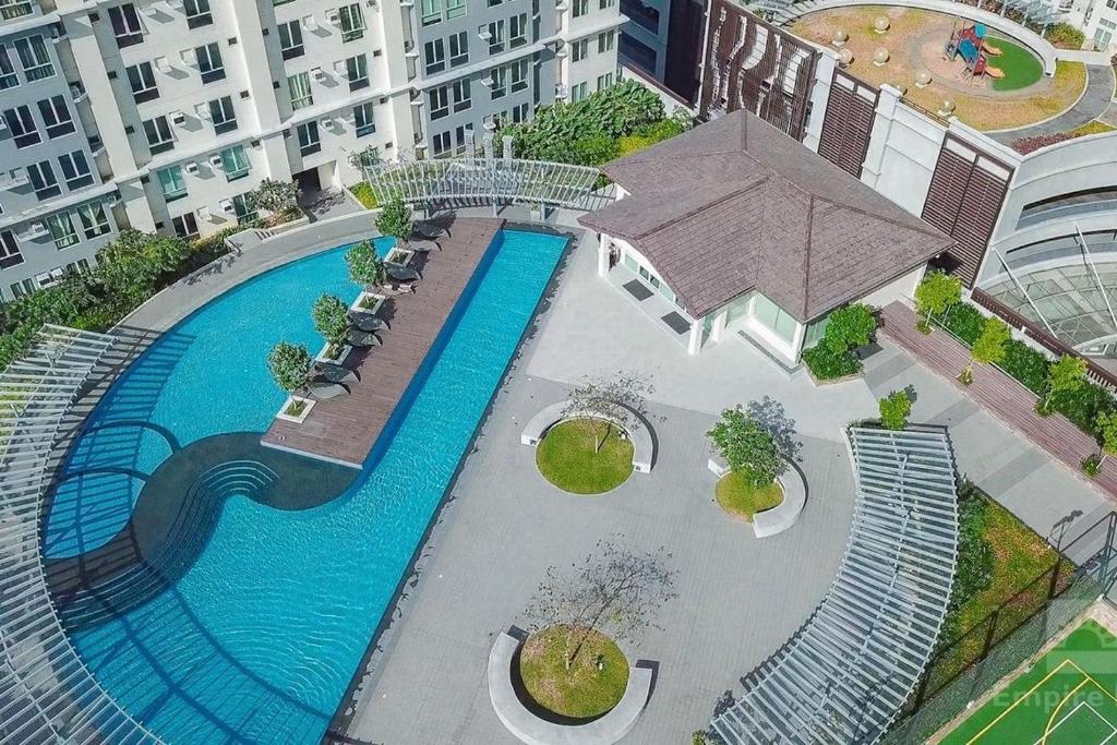 an overhead view of a swimming pool in a building at San Lorenzo Place in Manila