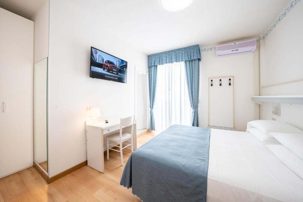 Postel nebo postele na pokoji v ubytování Hotel Laurin