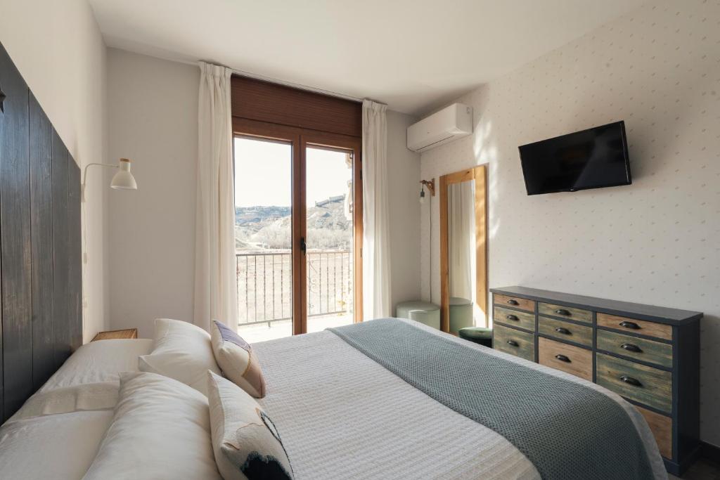 Postel nebo postele na pokoji v ubytování Hotel Casa Cauma