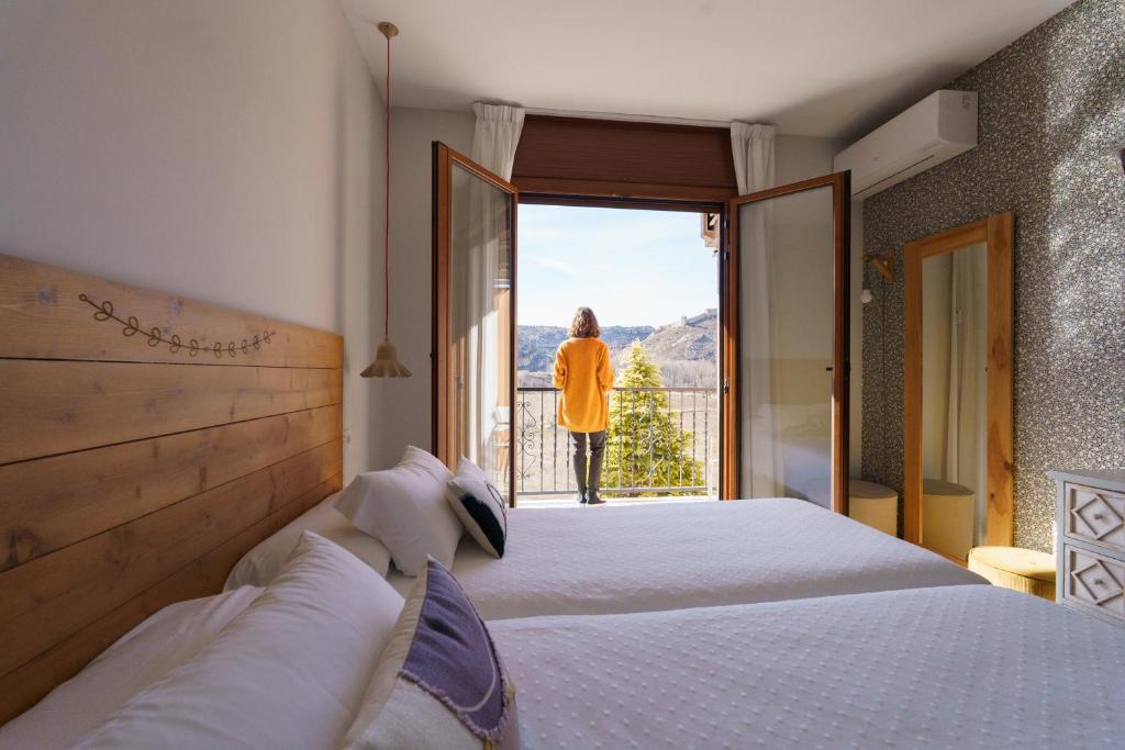 Postel nebo postele na pokoji v ubytování Hotel Casa Cauma