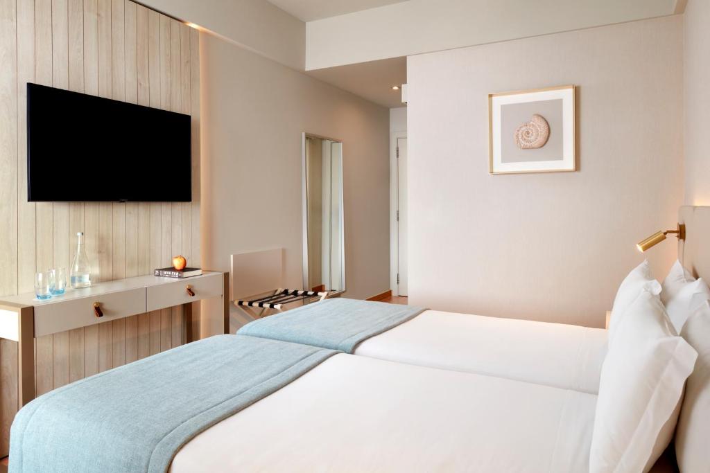Cama ou camas em um quarto em Dom Jose Beach Hotel (Plus)