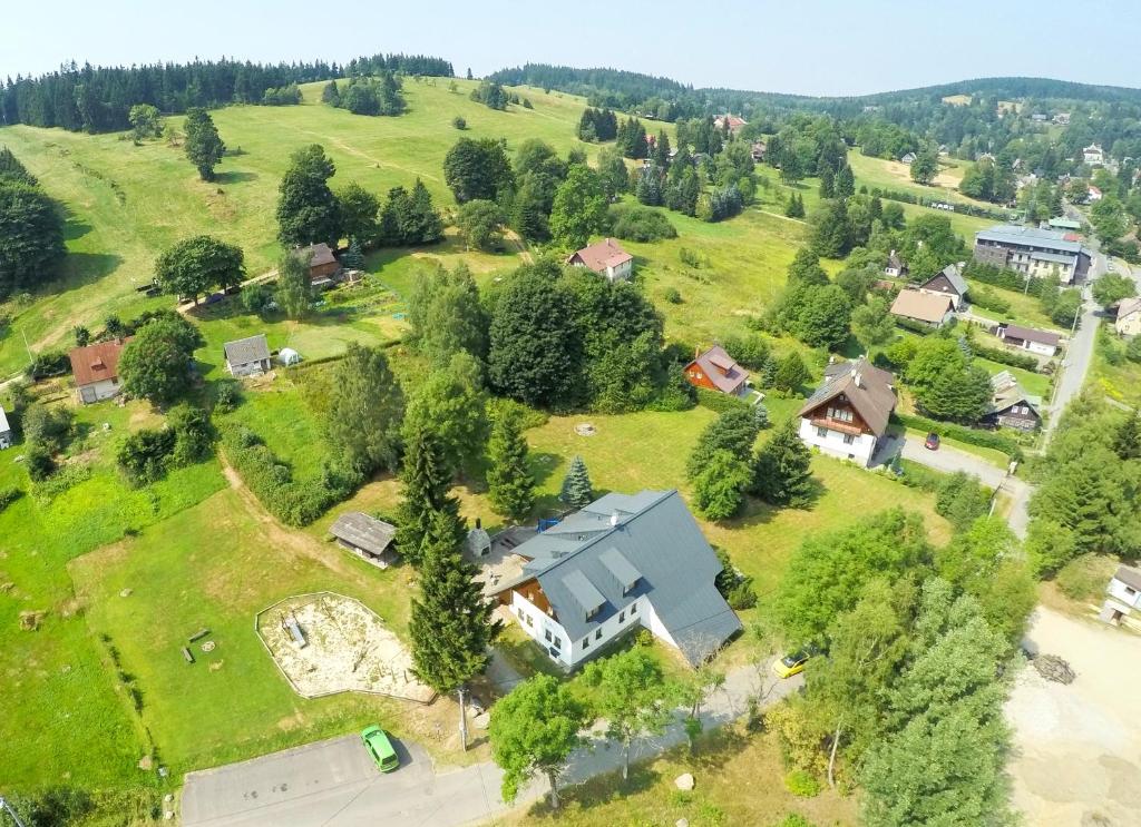 an aerial view of a house on a green field at Chata Nisanka in Bedřichov