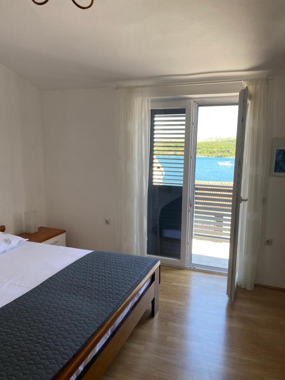 Postel nebo postele na pokoji v ubytování ŠPARADIĆI