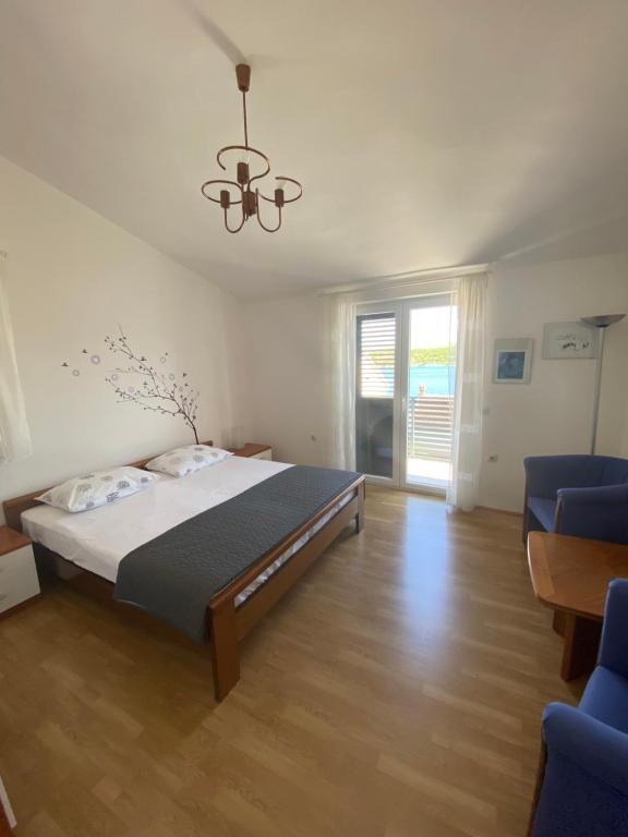 Postel nebo postele na pokoji v ubytování ŠPARADIĆI