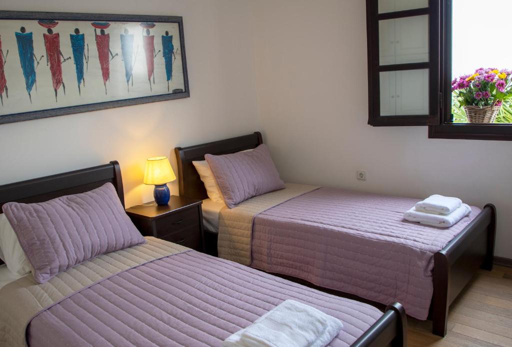 Voodi või voodid majutusasutuse My Way Kavos Villa toas