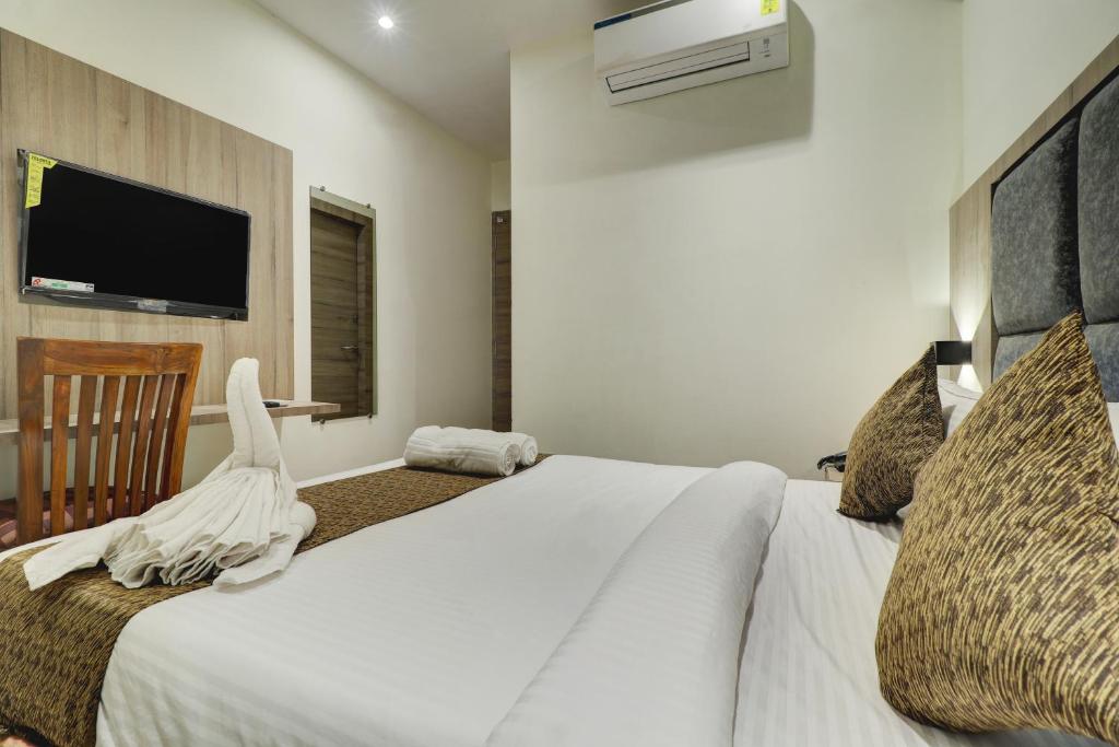 Postel nebo postele na pokoji v ubytování Hotel Sion Fort