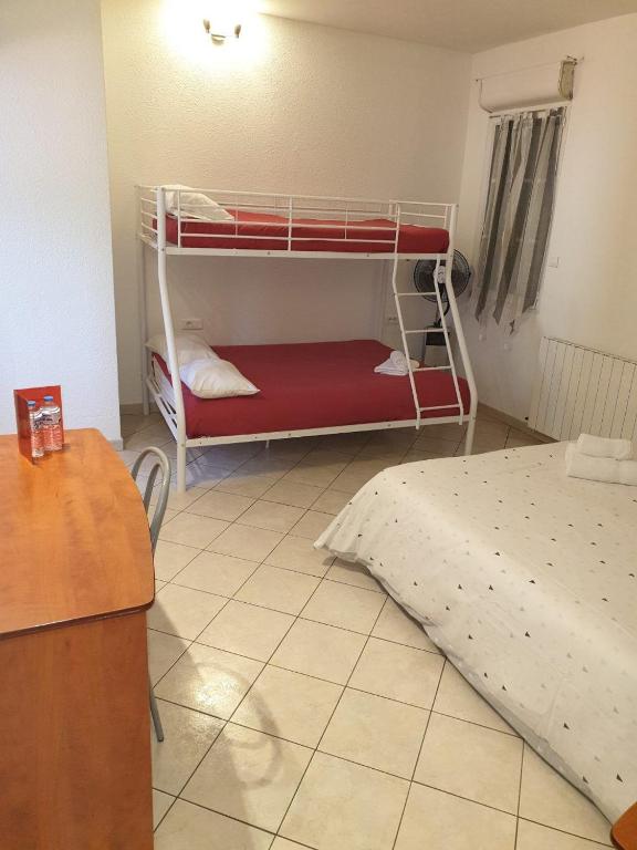 Postel nebo postele na pokoji v ubytování Le Castel d'olmes