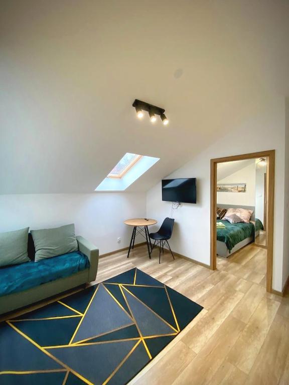 Postel nebo postele na pokoji v ubytování MH Apartments Towarnickiego