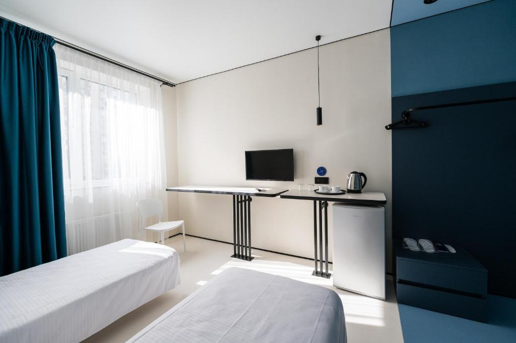 Postel nebo postele na pokoji v ubytování Ultramarinn Hotel